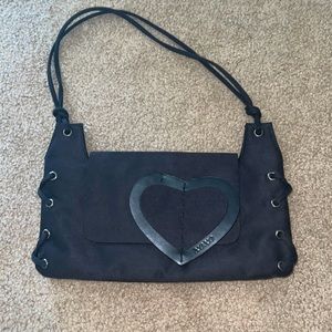 I am selling this black shoulder bag with a heart detail.